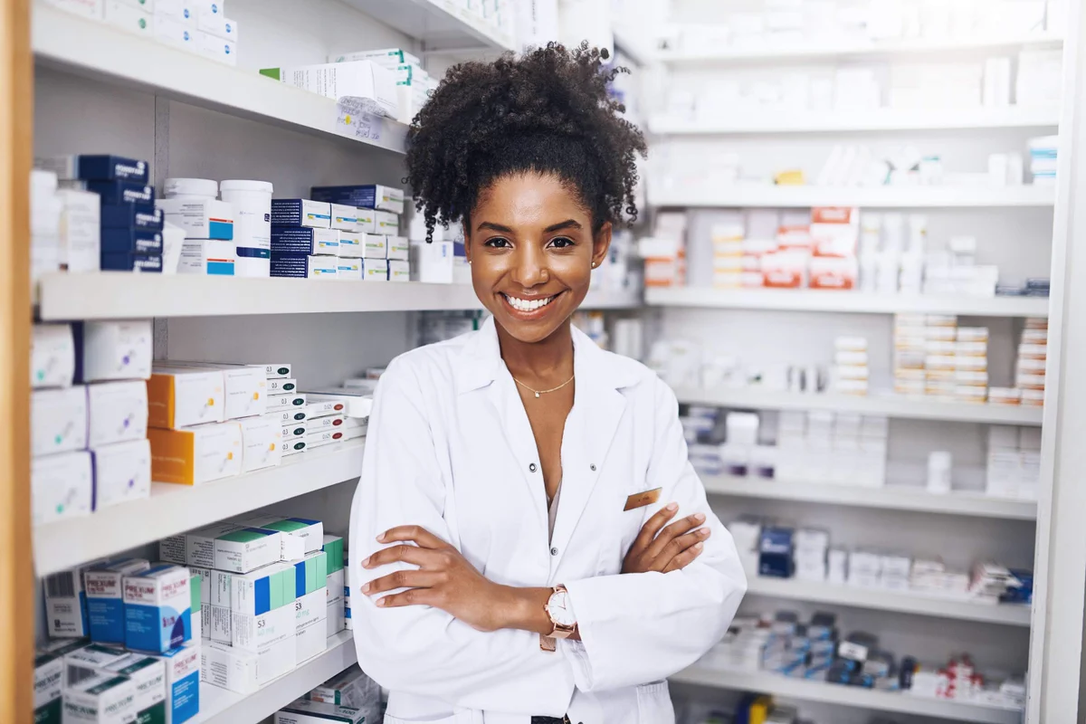 Pharmacist at a pharmacy shelf